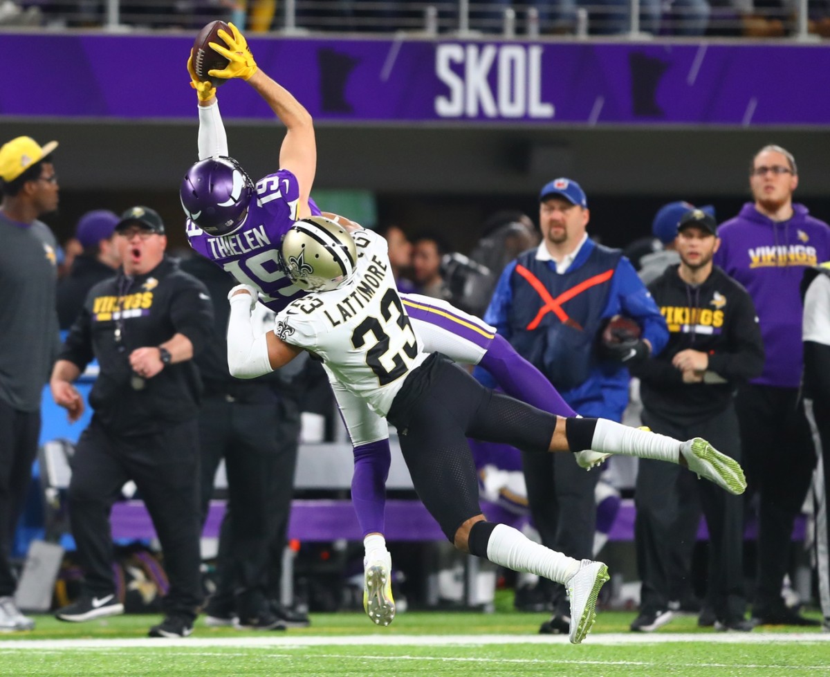 Minnesota Vikings receiver Adam Thielen (19) catches a pass against New Orleans Saints cornerback Marshon Lattimore (23). Mandatory Credit: Mark J. Rebilas-USA TODAY